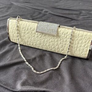 Elegant Cream Clutch with Silver Accents